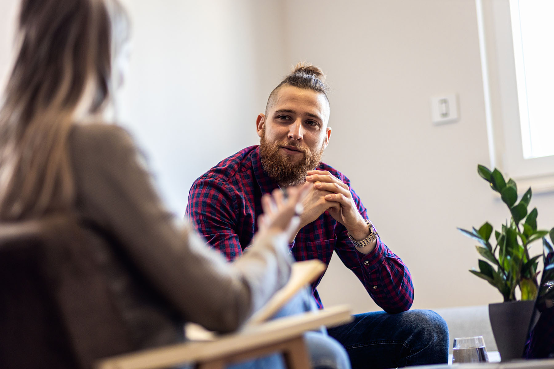 Man attentively listening during a counseling session, illustrating one-on-one therapy for anxiety or stress management