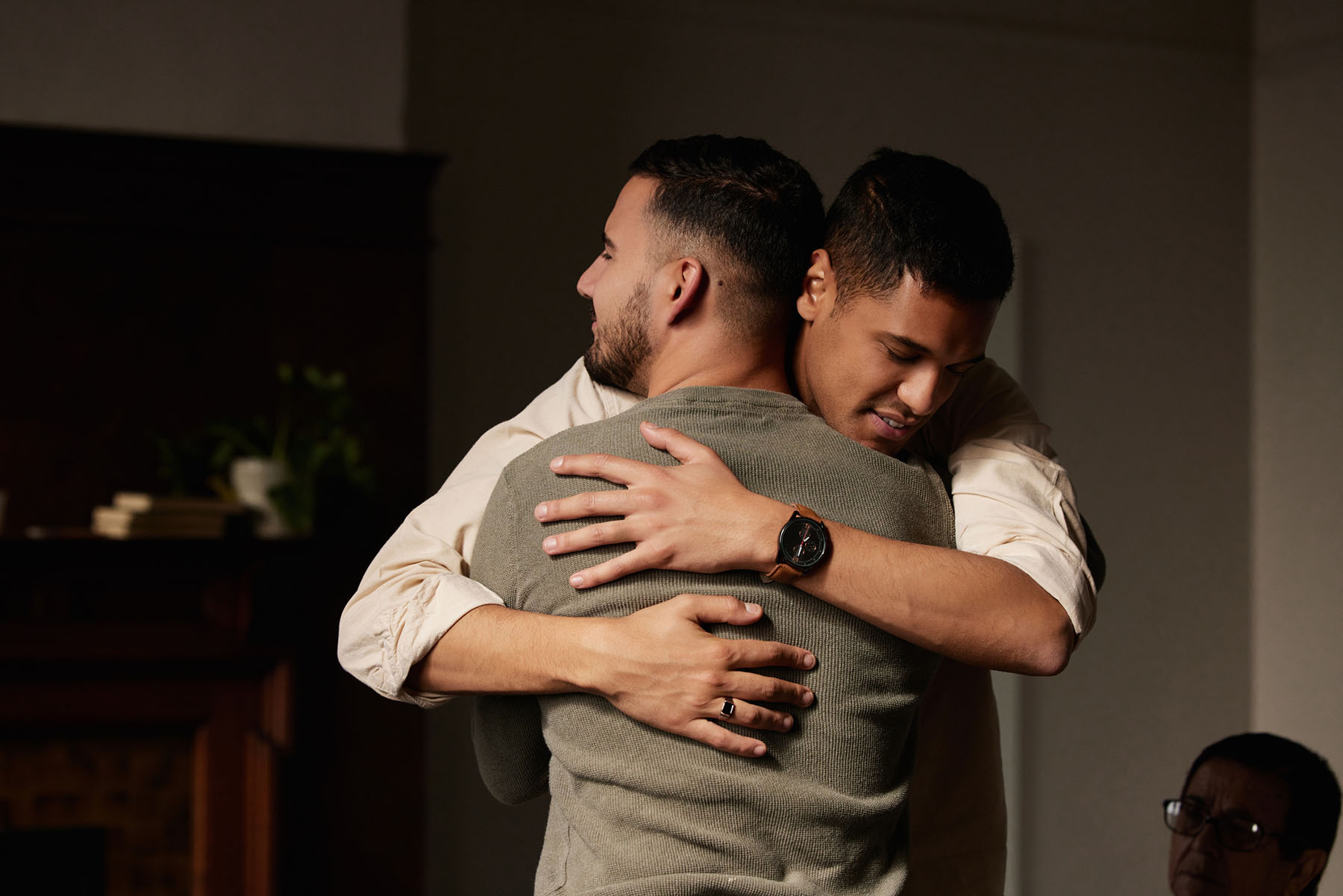 Two men embracing in a supportive hug, reflecting healing, emotional safety, and the power of connection in trauma recovery or relationship therapy.